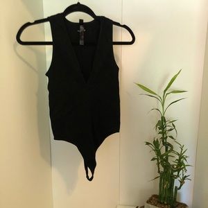 Plunge neck black ribbed bodysuit from Free People (size L)